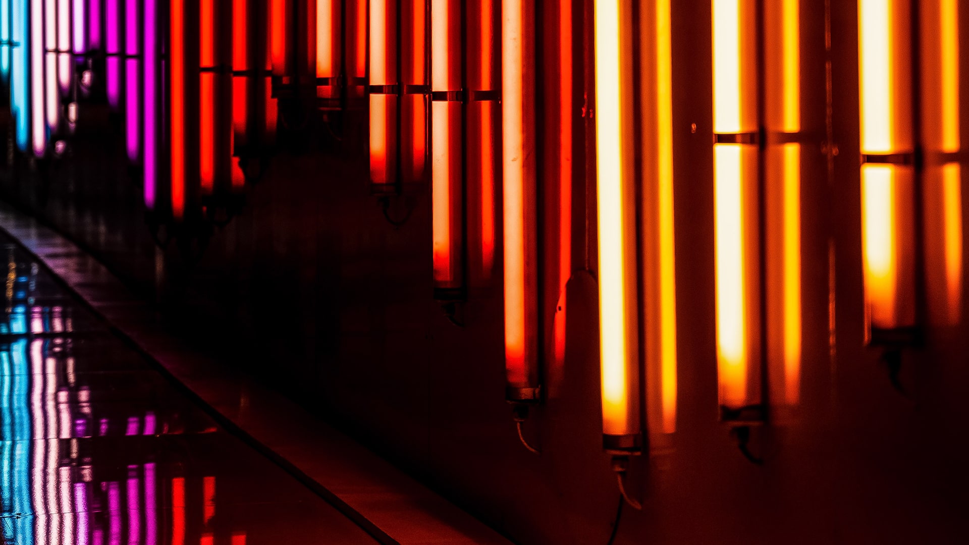 Neon lamp strips in yellow, red, purple and blue colours.