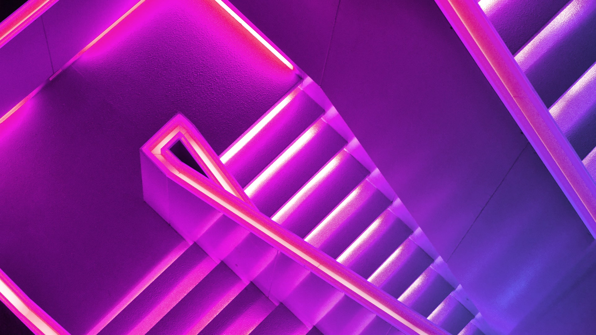 Staircase railings in neon purple colour. 
